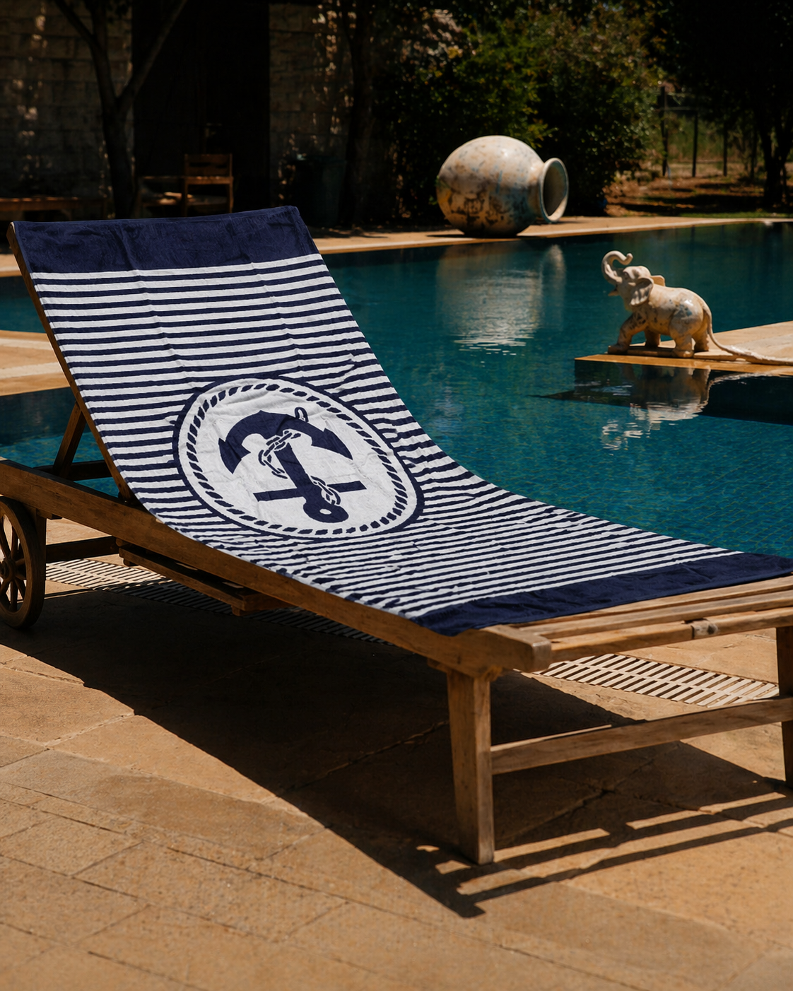 Navy and white sailor striped beach towel with central anchor and rope medallion