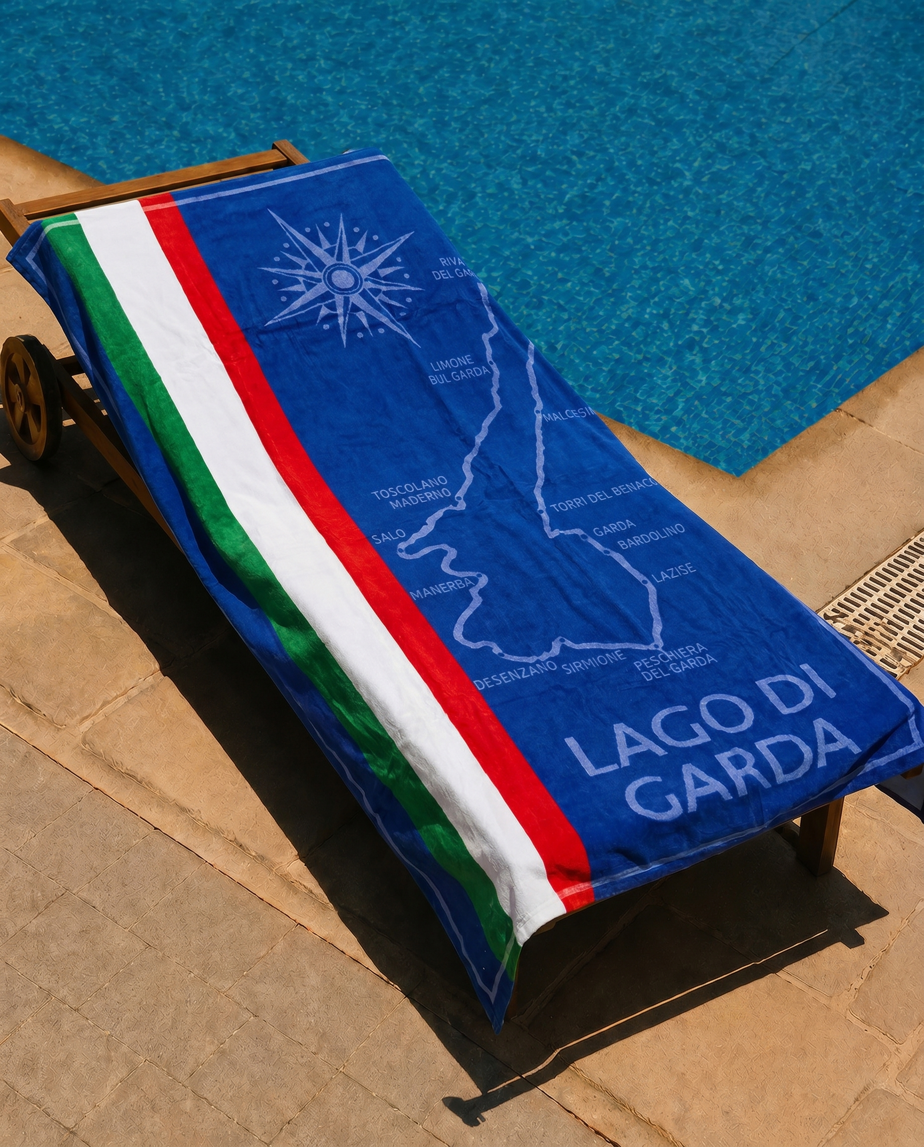Lago di Garda Beach Towel draped on a lounge chair