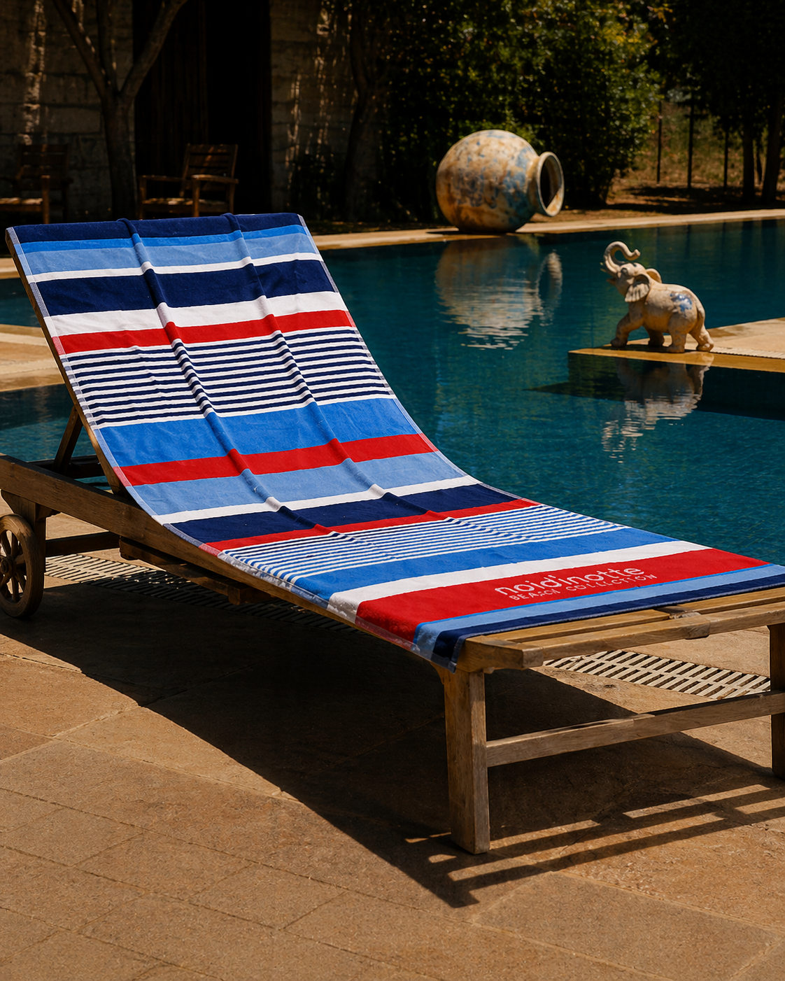 Blue, red, navy and white horizontal striped beach towel with mixed stripe widths