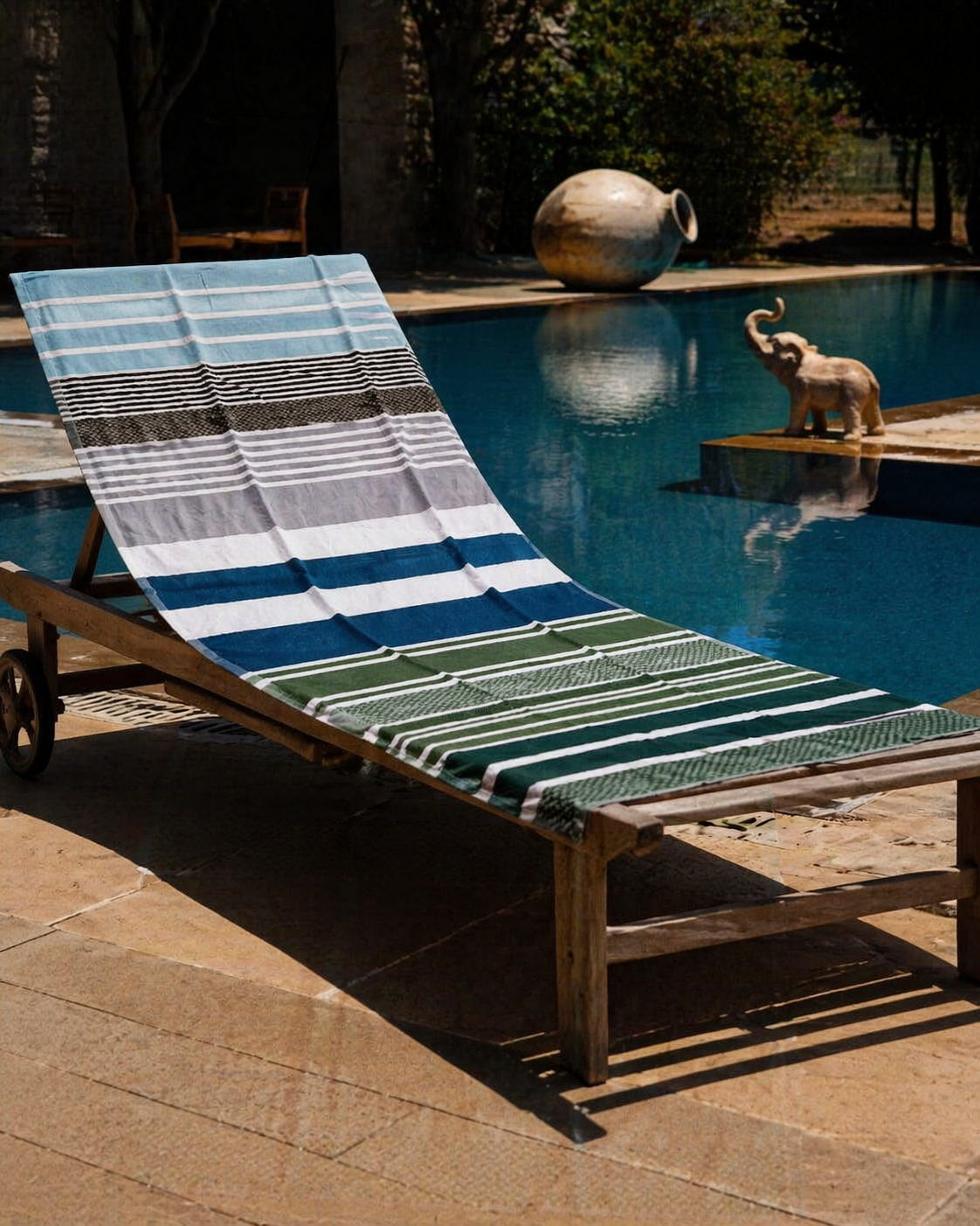 Beach towel with coastal sky blue, brown, grey, white, teal and forest green horizontal stripes